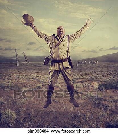 Hunter cheering in remote savanna landscape View Large Photo Image Picture - Hunter cheering in remote savanna landscape. Fotosearch