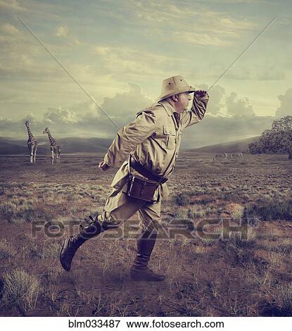 Stock Photo - Hunter searching in remote savanna landscape. Fotosearch