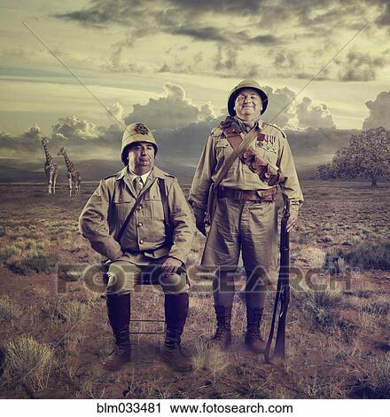 Hunters posing in savanna landscape View Large Photo Image Stock Image - Hunters posing in savanna landscape. Fotosearch
