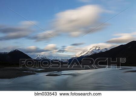 Mountains over remote river, Glenorchy, South Westland, New Zealand View Large Photo Image Stock Image - Mountains over remote river, Glenorchy, South Westland, New Zealand. Fotosearch