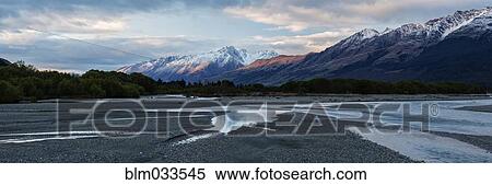Stock Photography - Mountains over remote river, Glenorchy, Central Otago, New Zealand. Fotosearch