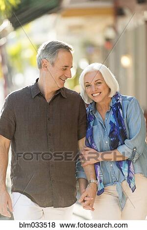 Older Caucasian couple holding hands outdoors View Large Photo Image Stock Photo - Older Caucasian couple holding hands outdoors. Fotosearch