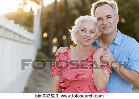 Older Caucasian couple hugging on beach View Large Photo Image Stock Photo - Older Caucasian couple hugging on beach. Fotosearch