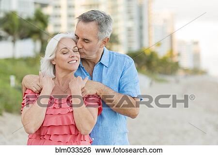 Older Caucasian couple walking on beach View Large Photo Image Stock Photograph - Older Caucasian couple walking on beach. Fotosearch