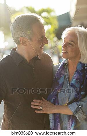Stock Image - Older Caucasian couple walking outdoors. Fotosearch
