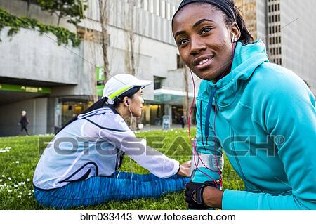 Runners stretching in urban park View Large Photo Image Stock Image - Runners stretching in urban park. Fotosearch