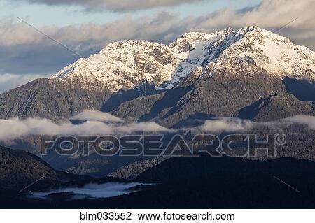 Snowcapped mountains in remote landscape, Te Anau, Southland, New Zealand View Large Photo Image Stock Image - Snowcapped mountains in remote landscape, Te Anau, Southland, New Zealand. Fotosearch