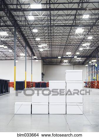 Stacked boxes in warehouse View Large Photo Image Picture - Stacked boxes in warehouse. Fotosearch
