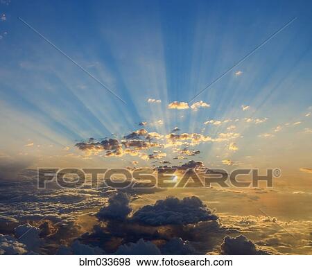Sunbeams and clouds in dramatic sky View Large Photo Image Stock Photo - Sunbeams and clouds in dramatic sky. Fotosearch