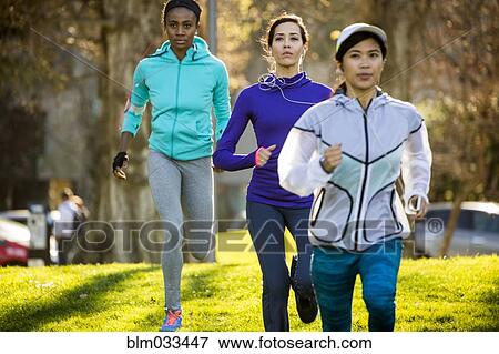 Women running in park View Large Photo Image Stock Photo - Women running in park. Fotosearch