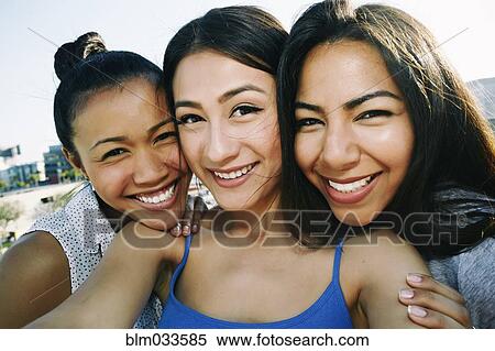 Women taking selfie on urban rooftop View Large Photo Image Stock Photography - Women taking selfie on urban rooftop. Fotosearch