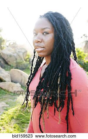 African American woman standing outdoors View Large Photo Image Stock Image - African American woman standing outdoors. Fotosearch