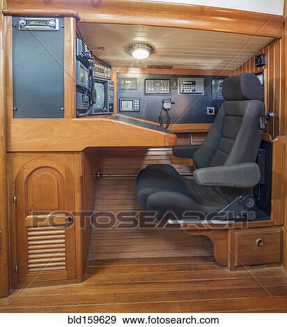 Stock Photo - Armchair in boat control room. Fotosearch