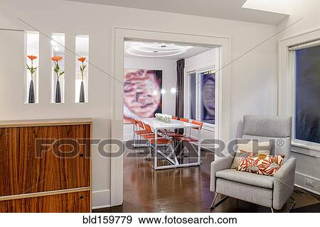 Stock Photo - Armchair near entrance to modern dining room. Fotosearch