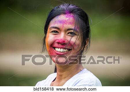 Stock Photo - Asian woman with pigment powder on face. Fotosearch