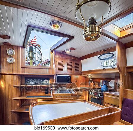 Stock Image - Below deck kitchen on houseboat. Fotosearch