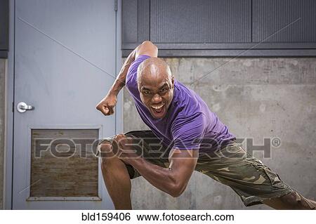 Black dancer crouching View Large Photo Image Stock Photograph - Black dancer crouching. Fotosearch