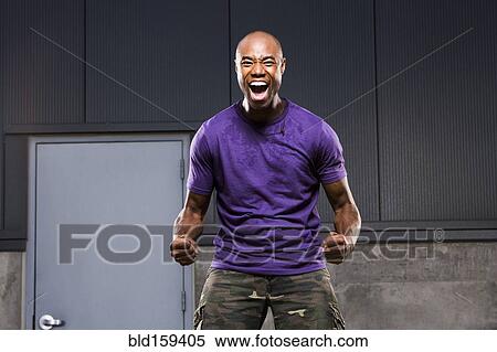 Stock Photography - Black man cheering. Fotosearch