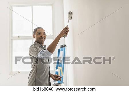 Black man painting wall of home View Large Photo Image Stock Image - Black man painting wall of home. Fotosearch