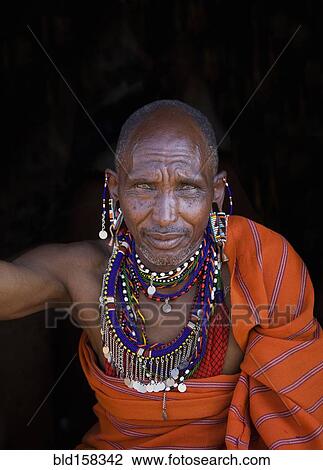 Stock Image - Black man wearing traditional jewelry and clothing. Fotosearch