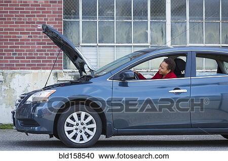 Black woman with broken down car View Large Photo Image Stock Image - Black woman with broken down car. Fotosearch