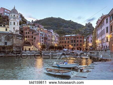 Stock Image - Canoes docked in Vernazza harbor, La Spezia, Italy. Fotosearch