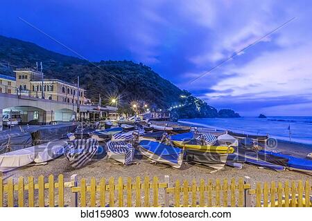 Canoes docked on beach under Monterosso al Mare cityscape, La Spezia, Italy View Large Photo Image Stock Image - Canoes docked on beach under Monterosso al Mare cityscape, La Spezia, Italy. Fotosearch