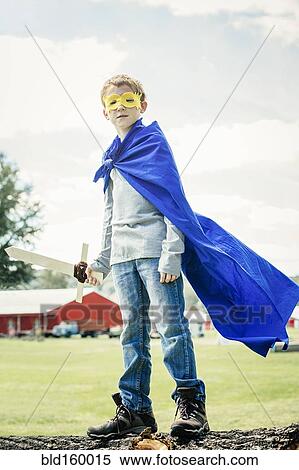 Stock Photography - Caucasian boy wearing costume on farm. Fotosearch