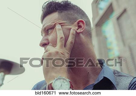 Caucasian businessman resting hand on chin View Large Photo Image Stock Image - Caucasian businessman resting hand on chin. Fotosearch