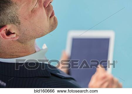 Stock Photograph - Caucasian businessman using digital tablet. Fotosearch