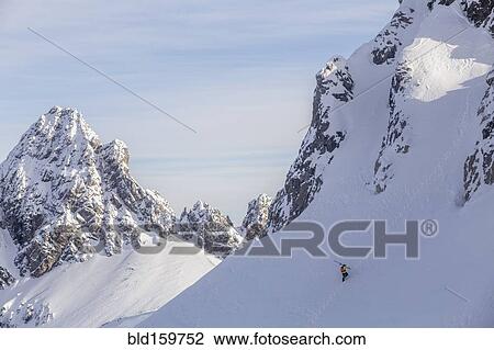 Caucasian climber scaling snowy mountain slope View Large Photo Image Stock Image - Caucasian climber scaling snowy mountain slope. Fotosearch