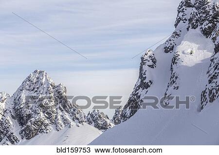 Caucasian climber scaling snowy mountain slope View Large Photo Image Stock Image - Caucasian climber scaling snowy mountain slope. Fotosearch