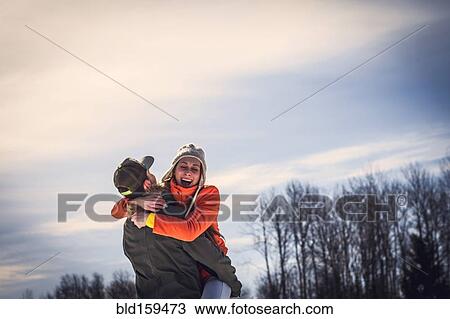 Caucasian couple hugging outdoors View Large Photo Image Stock Image - Caucasian couple hugging outdoors. Fotosearch