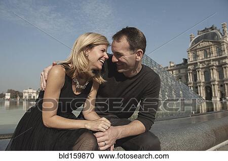 Caucasian couple laughing near fountain, Paris, Ile-de-France, France View Large Photo Image Stock Image - Caucasian couple laughing near fountain, Paris, Ile-de-France, France. Fotosearch