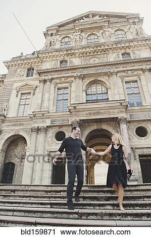 Caucasian couple walking on ornate building steps, Paris, Ile-de-France, France View Large Photo Image Stock Image - Caucasian couple walking on ornate building steps, Paris, Ile-de-France, France. Fotosearch