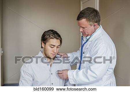 Caucasian doctor listening to heartbeat of patient View Large Photo Image Stock Photo - Caucasian doctor listening to heartbeat of patient. Fotosearch