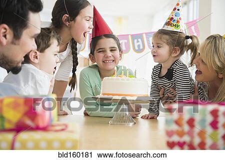 Caucasian family celebrating at birthday party View Large Photo Image Stock Image - Caucasian family celebrating at birthday party. Fotosearch