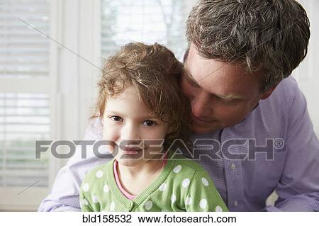 Caucasian father and daughter hugging View Large Photo Image Stock Image - Caucasian father and daughter hugging. Fotosearch