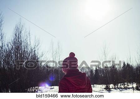 Stock Photograph - Caucasian girl in snowy field. Fotosearch