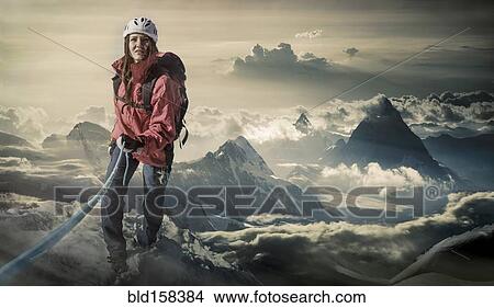 Picture - Caucasian hiker climbing mountain, Monte Rosa, Alps, Italy. Fotosearch