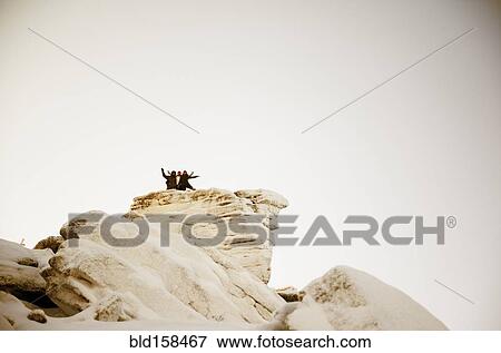 Caucasian hikers on snowy mountaintop View Large Photo Image Stock Photo - Caucasian hikers on snowy mountaintop. Fotosearch