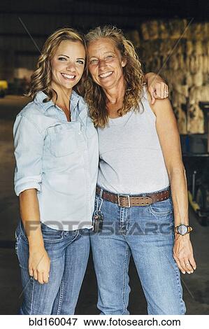 Stock Photo - Caucasian mother and daughter hugging. Fotosearch