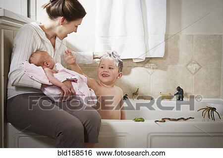 Caucasian mother and newborn washing son in bath View Large Photo Image Stock Photograph - Caucasian mother and newborn washing son in bath. Fotosearch