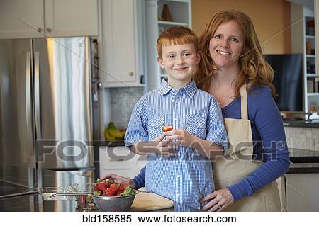 Caucasian mother and son cooking in kitchen View Large Photo Image Stock Photography - Caucasian mother and son cooking in kitchen. Fotosearch