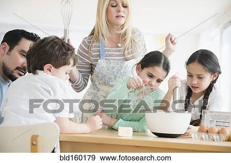 Caucasian parents and children baking in kitchen View Large Photo Image Stock Photo - Caucasian parents and children baking in kitchen. Fotosearch