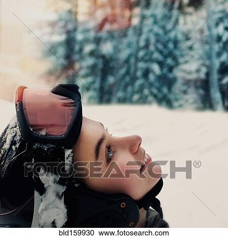 Caucasian snowboarder wearing goggles and helmet looking up View Large Photo Image Stock Image - Caucasian snowboarder wearing goggles and helmet looking up. Fotosearch