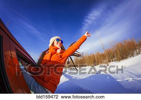 Caucasian woman leaning out car window in snowy field View Large Photo Image Stock Image - Caucasian woman leaning out car window in snowy field. Fotosearch