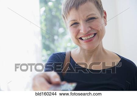 Caucasian woman paying with credit card View Large Photo Image Picture - Caucasian woman paying with credit card. Fotosearch