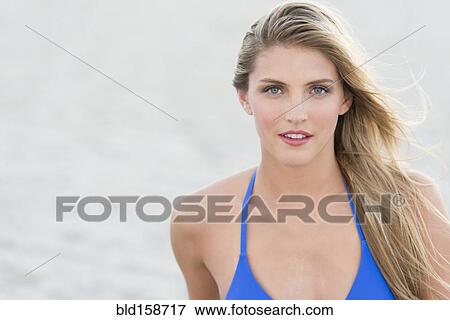 Caucasian woman wearing bikini on beach View Large Photo Image Stock Photo - Caucasian woman wearing bikini on beach. Fotosearch