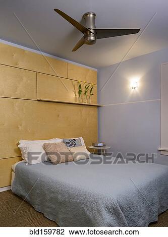 Ceiling fan and bed in modern bedroom View Large Photo Image Stock Image - Ceiling fan and bed in modern bedroom. Fotosearch